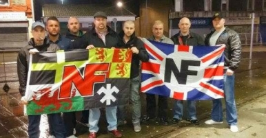 NF Wales in Merthyr, 2015, dragging Welsh symbols through the dirt